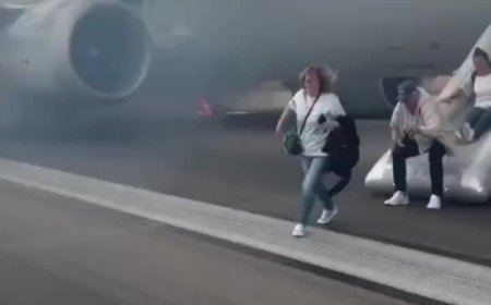 现场浓烟滚滚：美国航空一波音客机发生故障乘客紧急撤离，一人轻伤