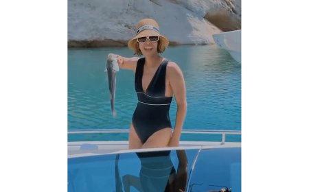 Halle Berry Sizzles in a Sexy Plunging Swimsuit While Fishing