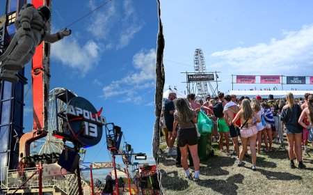 Thrill ride malfunctions at popular music festival, leaving riders stuck upside down