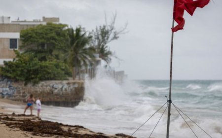 美国国家飓风中心称“艾琳”已降为3级飓风