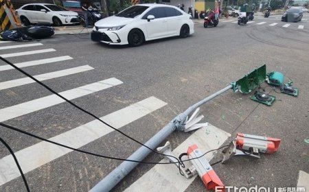 桃園大貨車吊臂未降下勾倒號誌桿　害對向騎士滑倒車損