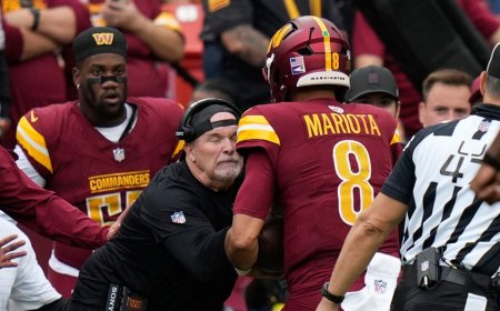 Commanders' Dan Quinn left bloodied after quarterback runs into him during play
