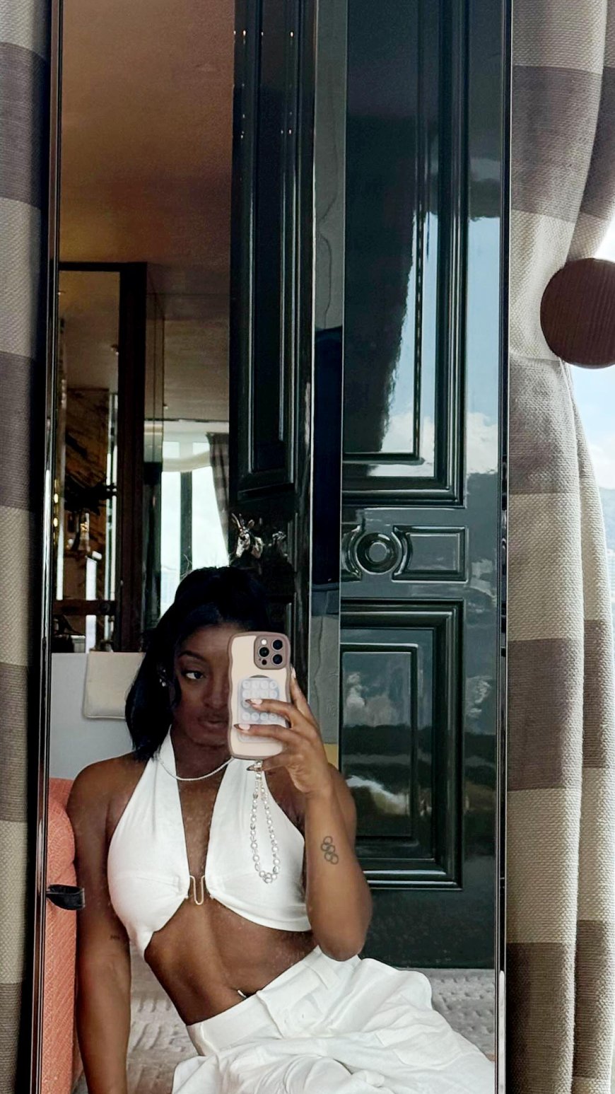 Simone Biles Shows Off Abs and Belly Button Piercing in Crop Top and Pants