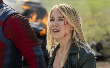 ‘Peacemaker’ Star Jennifer Holland On Harcourt’s Romantic Journey and the ‘Fun’ of Her Fight Scenes: ‘I Got to Throw “Mein Kampf” at a Nazi’s Face’