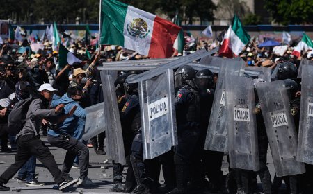 More than 100 officers injured as protesters attack police, breach barrier at Mexico's National Palace