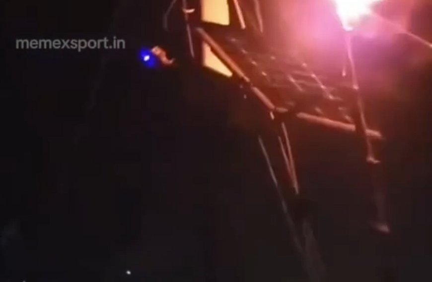 印度男子夜举火把给太阳能板充电 成功点亮LED指示灯