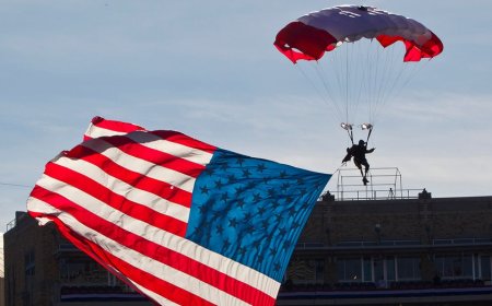 Parachutist briefly hangs above end zone during Armed Forces Bowl pregame mishap