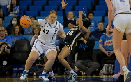 UCLA's two-sport star Megan Grant celebrates the Bruins national title
